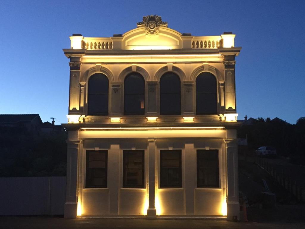 a building with lights on top of it at The Old Confectionery in Oamaru