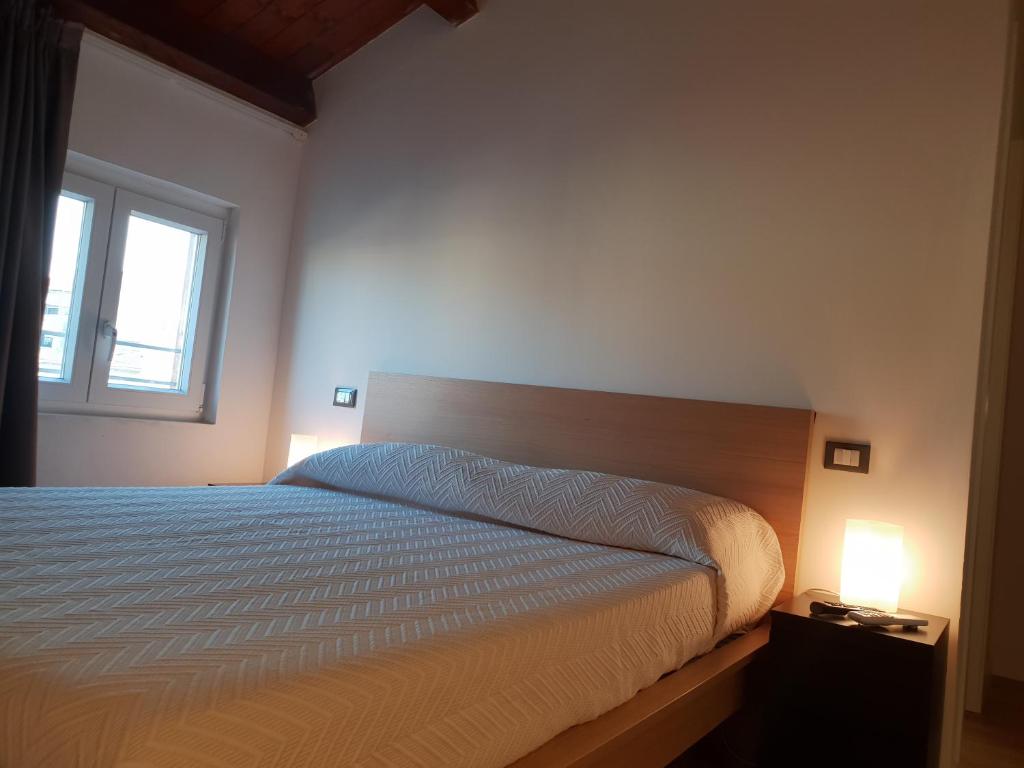 Postel nebo postele na pokoji v ubytování Terrazze Caracciolo