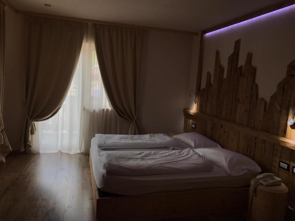 Postel nebo postele na pokoji v ubytování Park Hotel Avisio