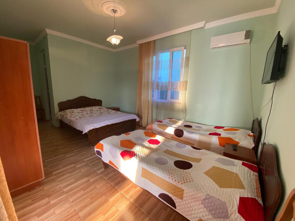 Postel nebo postele na pokoji v ubytování Beliy Dom