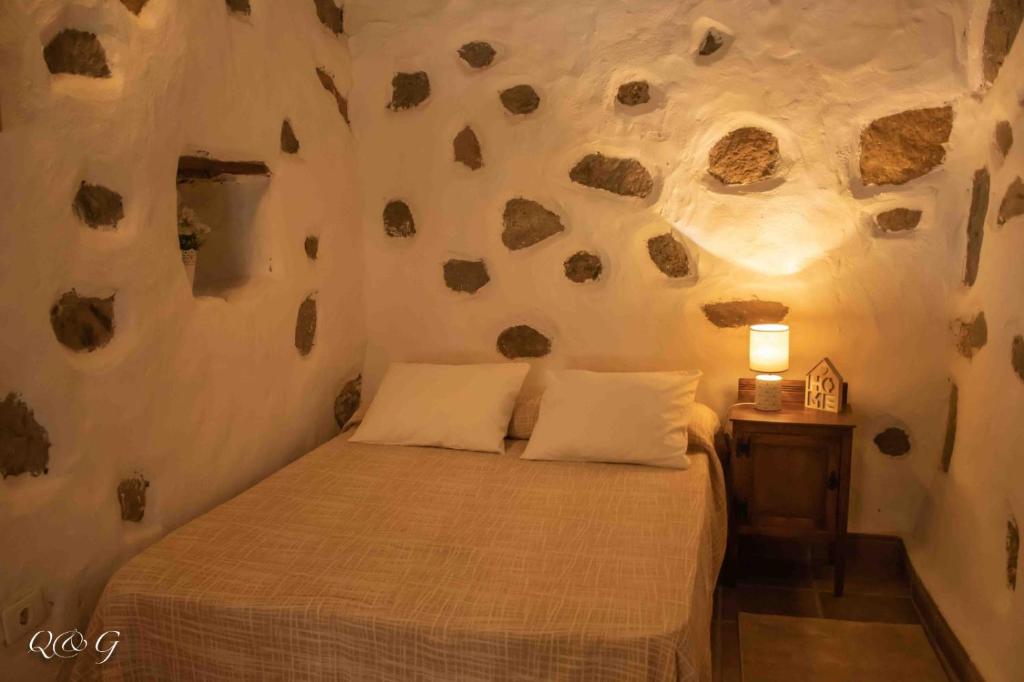 Postel nebo postele na pokoji v ubytování Vv El Lagar de Tunte Fibra Internet