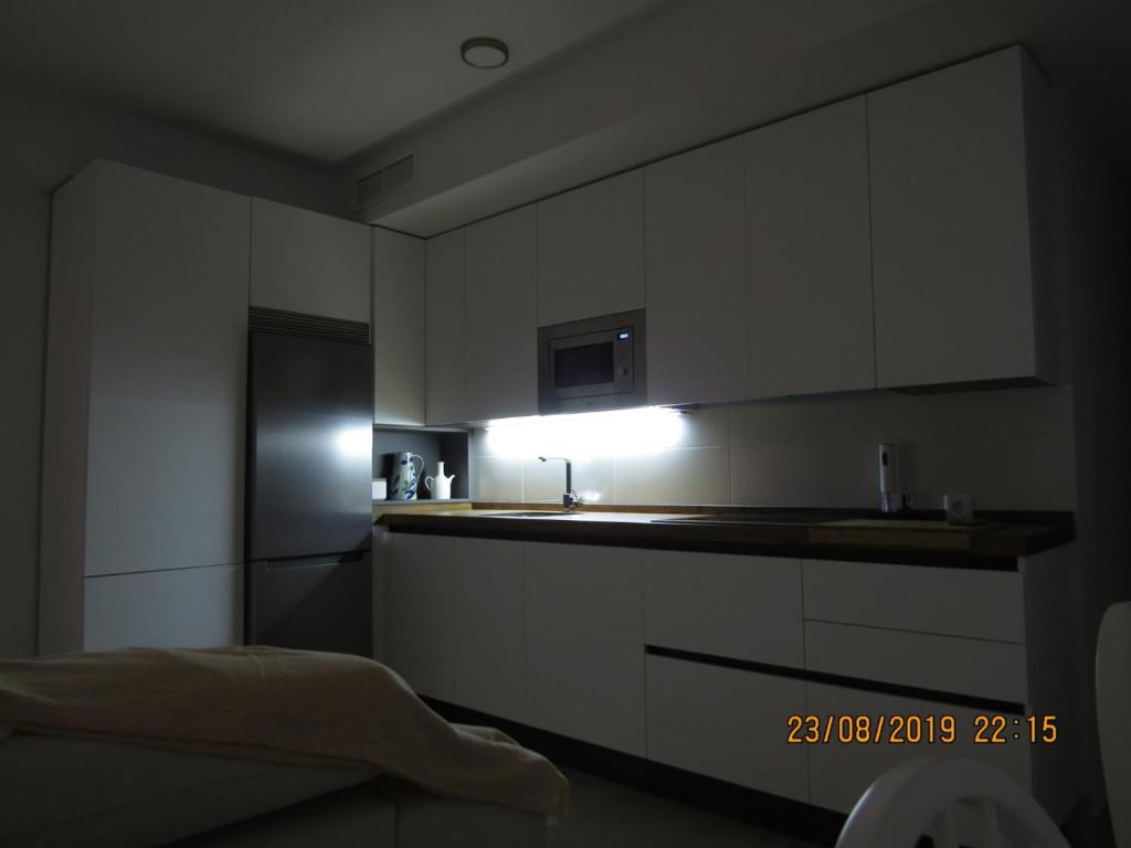 Kuchyň nebo kuchyňský kout v ubytování Apartamentos Cachón