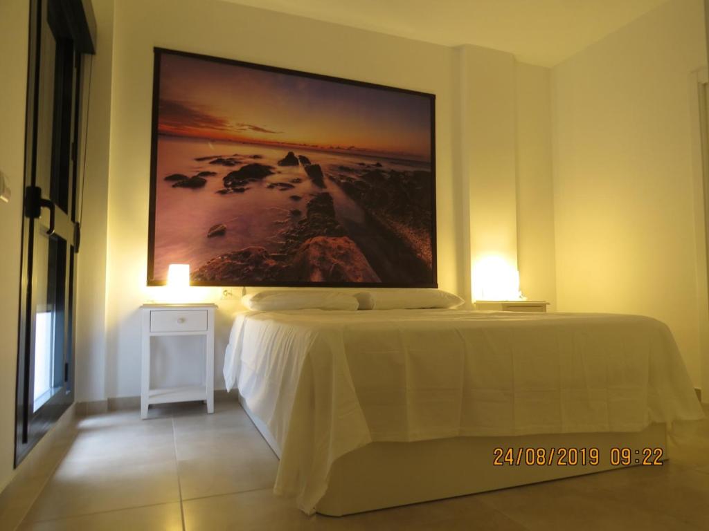 Postel nebo postele na pokoji v ubytování Apartamentos Cachón