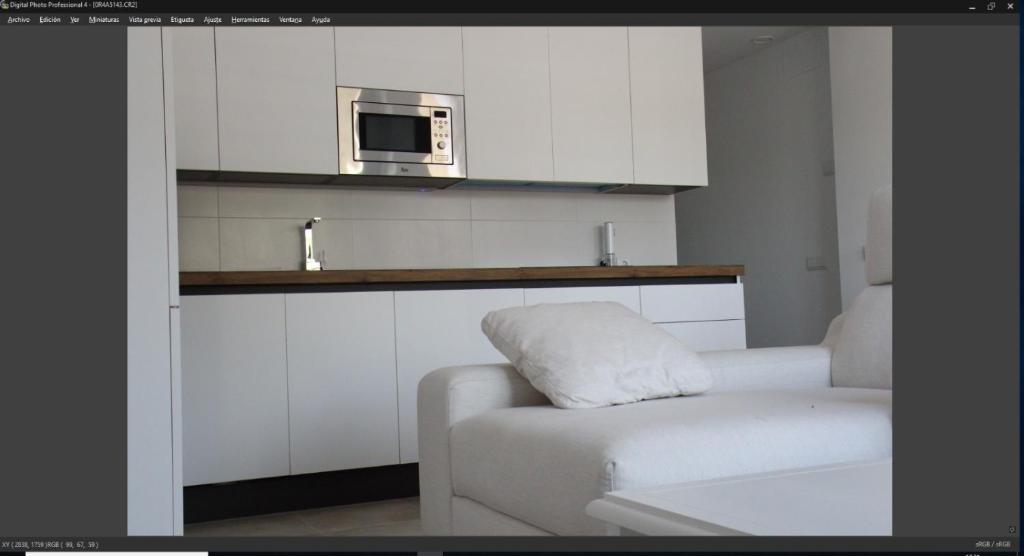 Postel nebo postele na pokoji v ubytování Apartamentos Cachón
