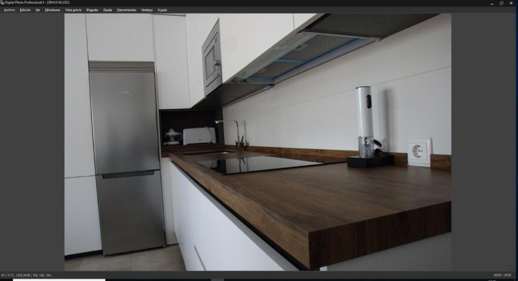 Kuchyň nebo kuchyňský kout v ubytování Apartamentos Cachón