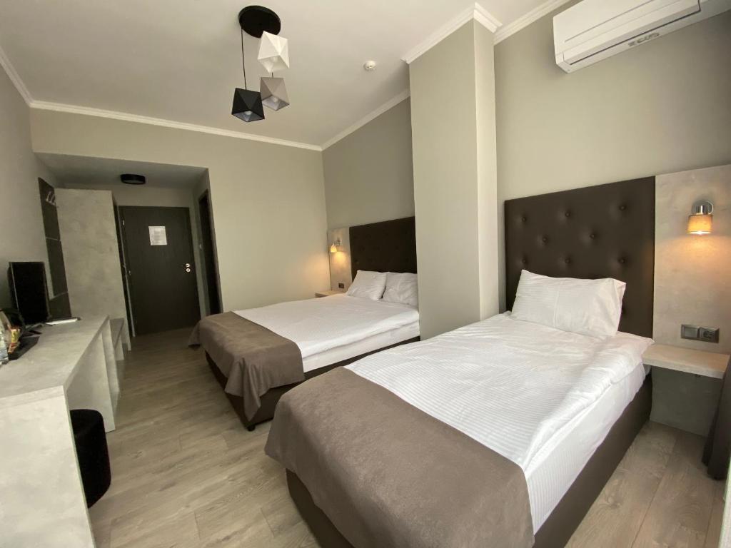 Comfort Guest Rooms - Habitación Triple Estándar