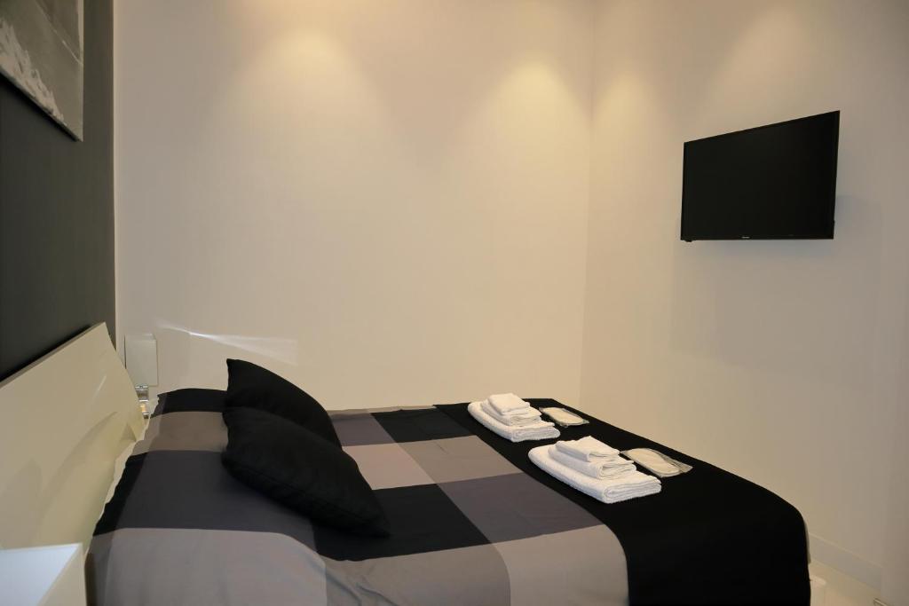A bed or beds in a room at Rettifilo 201 Exclusive Rooms