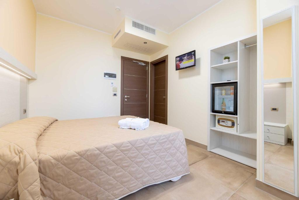 Postel nebo postele na pokoji v ubytování Hotel Salento Mirfran