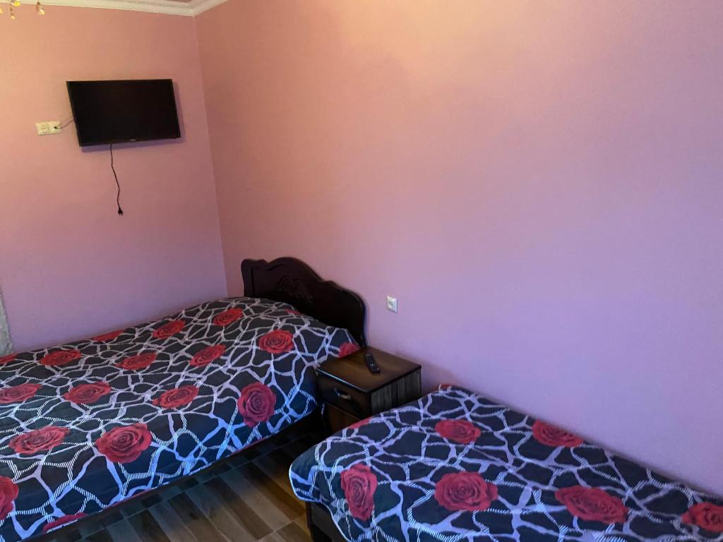 Postel nebo postele na pokoji v ubytování Beliy Dom