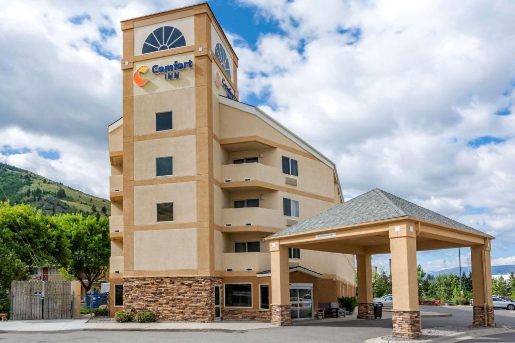 a hotel building with a gazebo in front of it at Comfort Inn University in Missoula