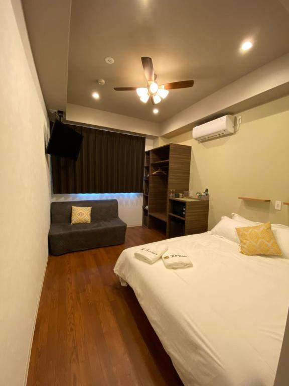 Postel nebo postele na pokoji v ubytování Kainoa Guesthouse