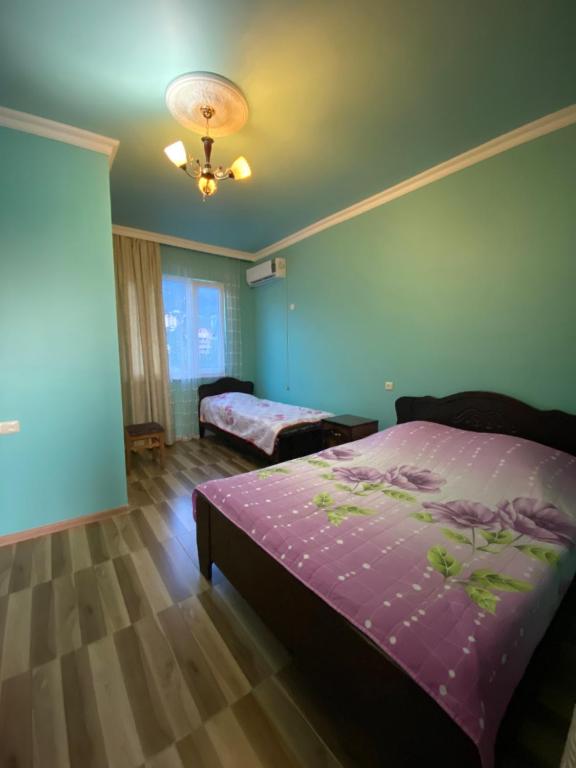 Postel nebo postele na pokoji v ubytování Beliy Dom