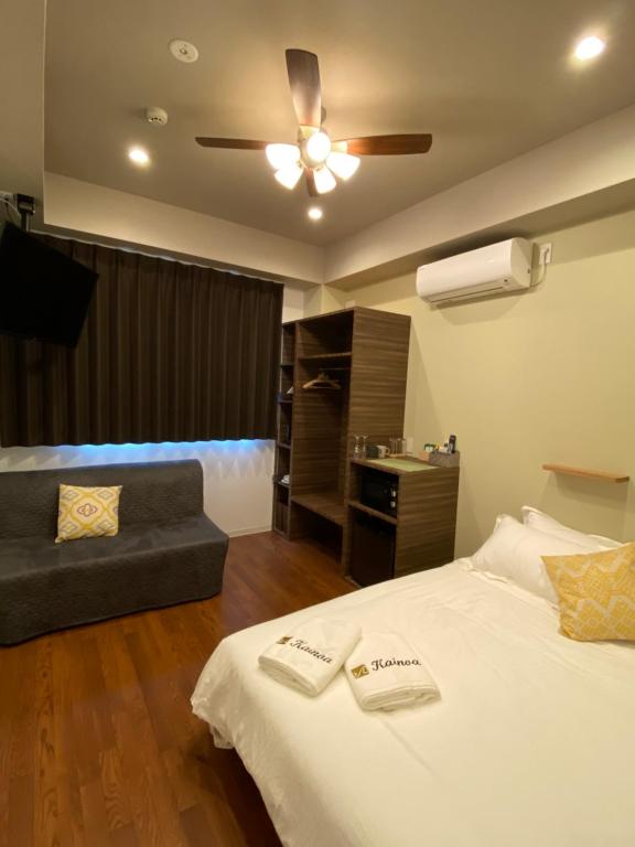 Postel nebo postele na pokoji v ubytování Kainoa Guesthouse