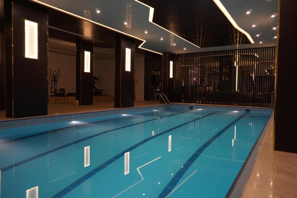 a large swimming pool in a building at Crystal Blue Rabigh 2 in Rabigh