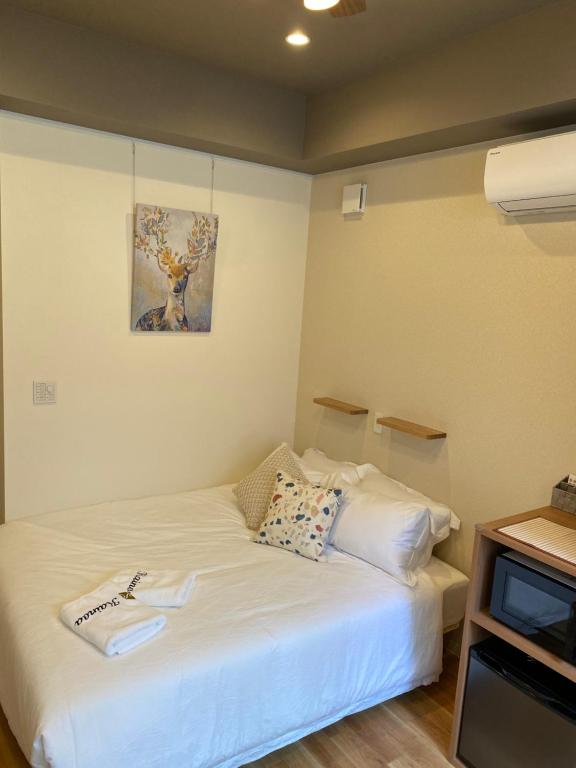 Postel nebo postele na pokoji v ubytování Kainoa Guesthouse