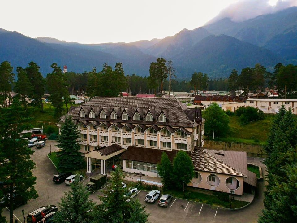 an aerial view of a large building with a parking lot at Energetik Hotel in Arkhyz