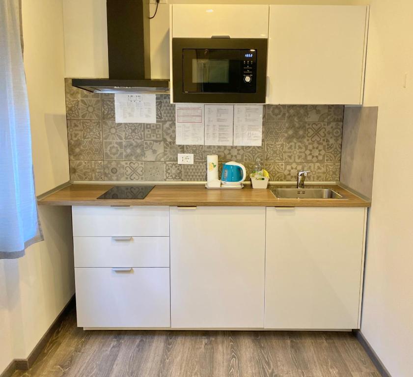 Kuchyňa alebo kuchynka v ubytovaní Mimì Rooms&Studios