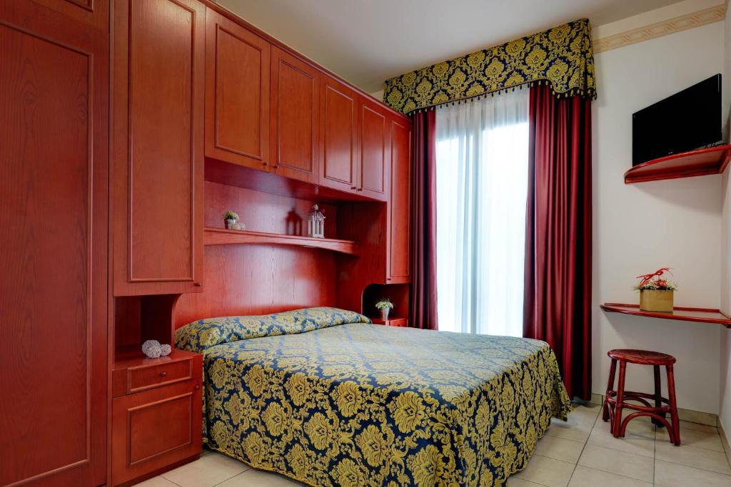 Postel nebo postele na pokoji v ubytování Hotel Garni San Carlo