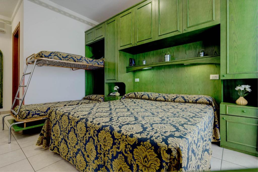 Postel nebo postele na pokoji v ubytování Hotel Garni San Carlo