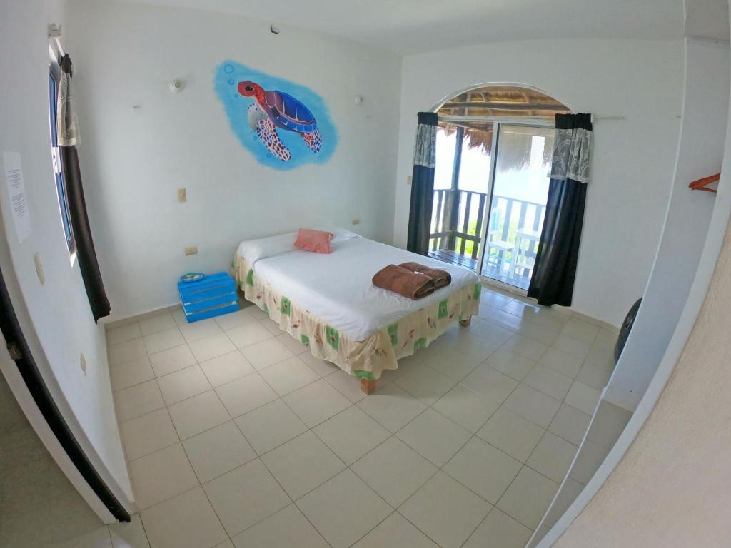 Postel nebo postele na pokoji v ubytování Casa Kayab