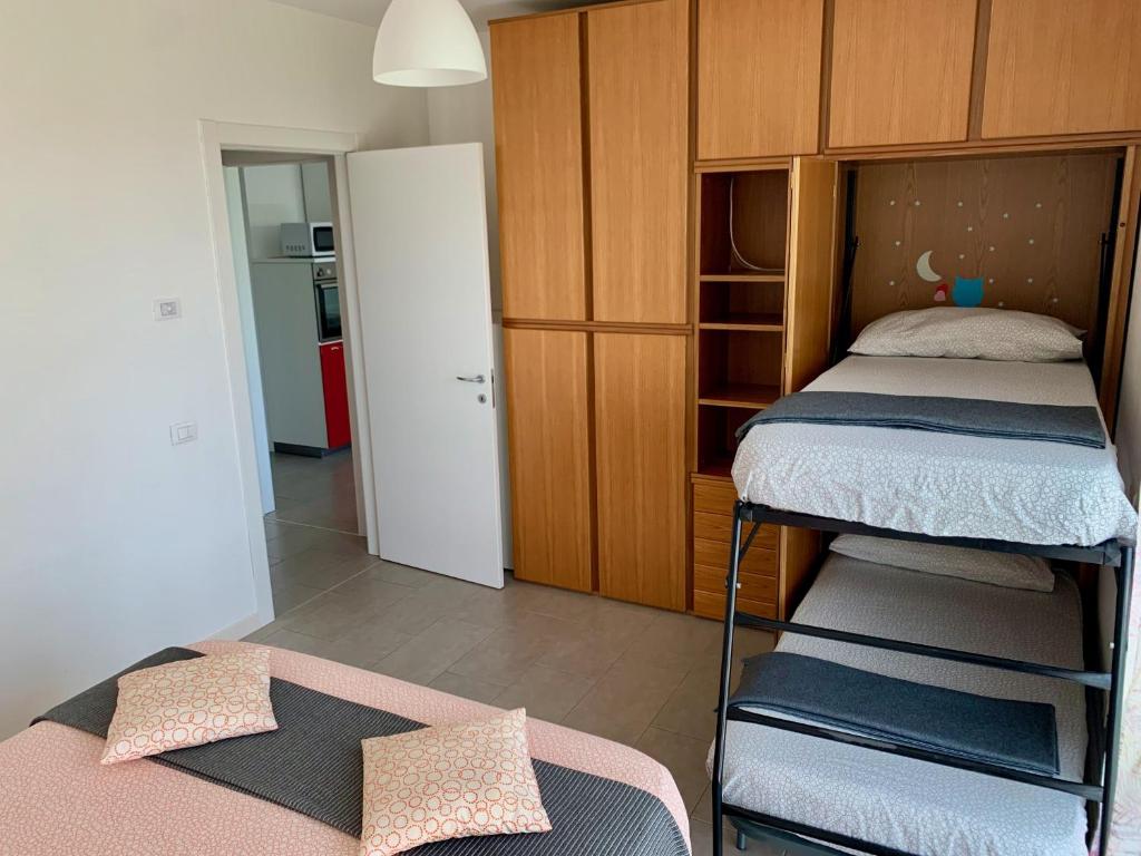 Posteľ alebo postele v izbe v ubytovaní Ennodio Apartment