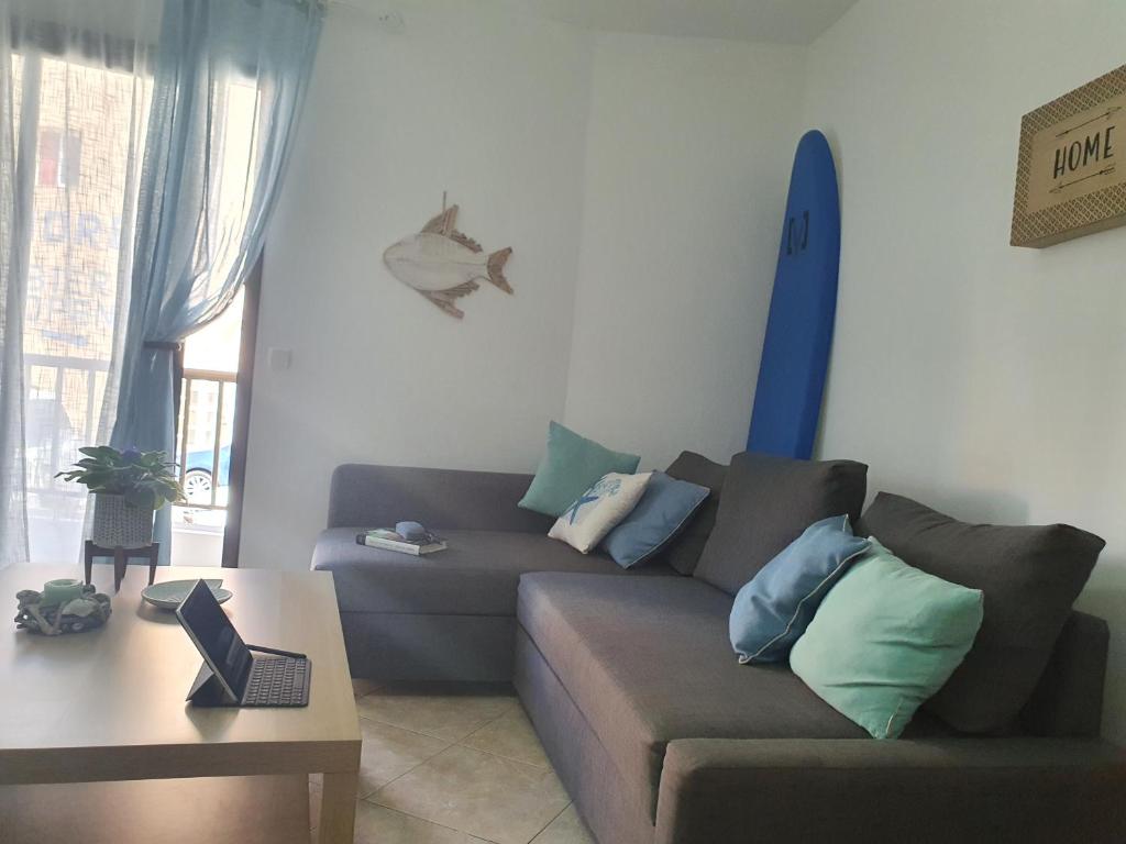 a living room with a couch and a table at Mi Cotillo in Cotillo