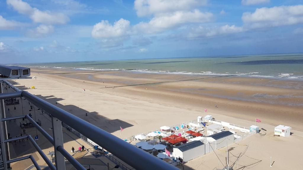 a view of a beach with umbrellas and the ocean at C view Casino in Middelkerke