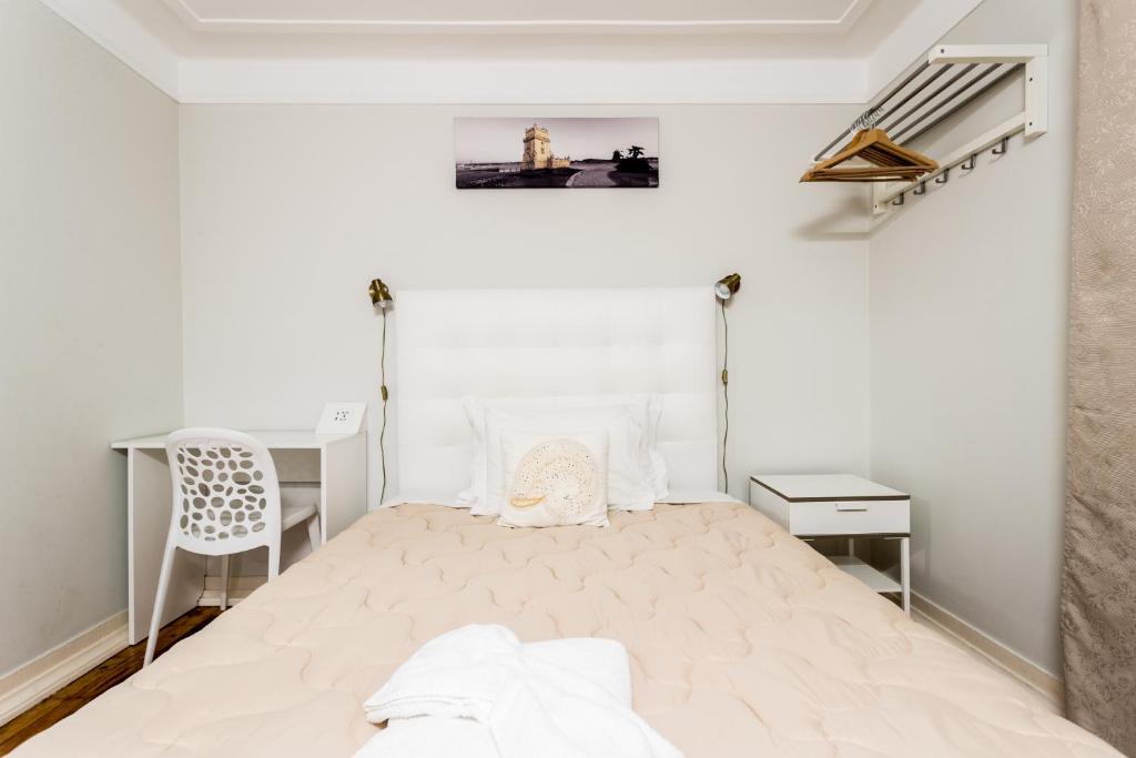 Cama ou camas em um quarto em Lisboa Central Hostel