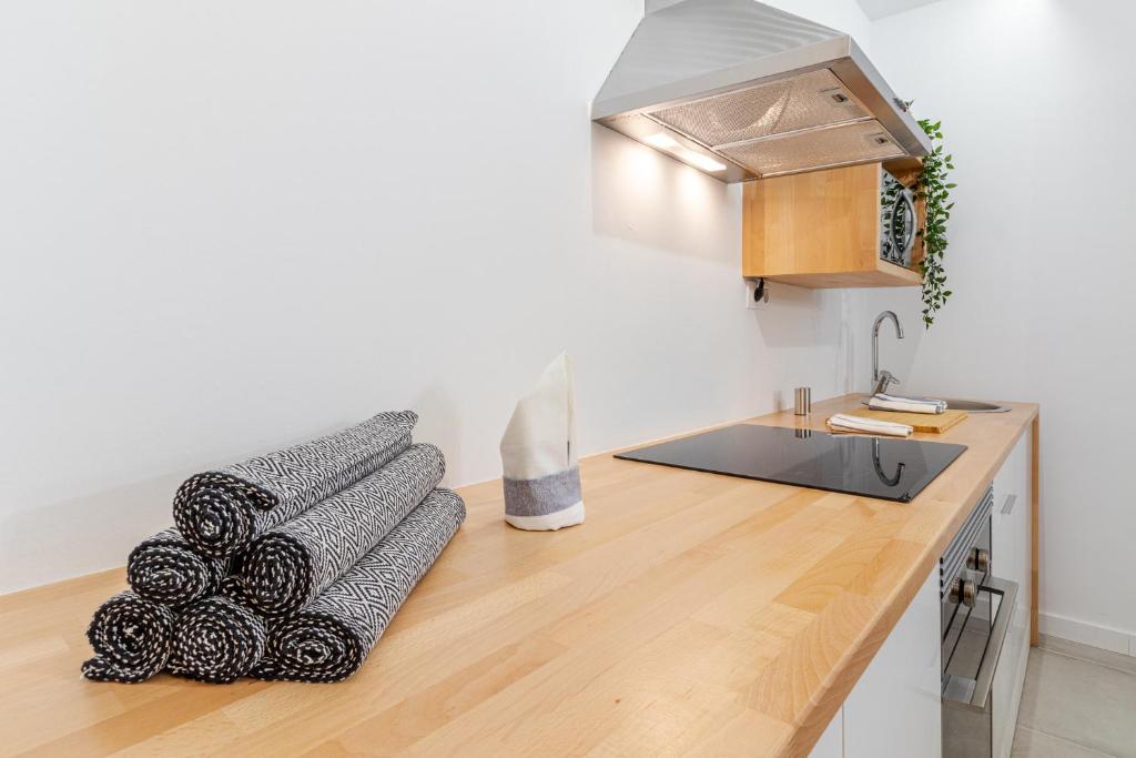 Kuchyň nebo kuchyňský kout v ubytování Flatguest Paez Suites