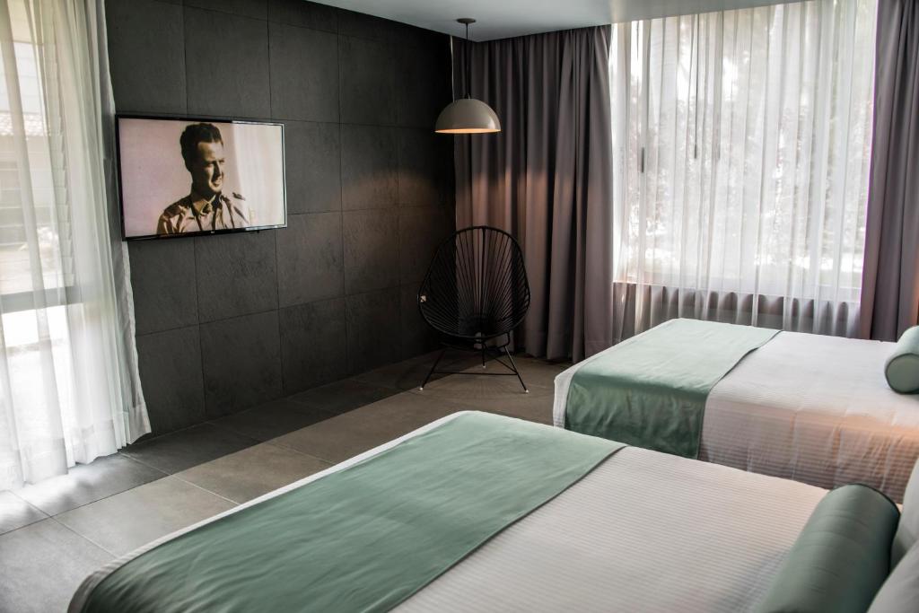Postel nebo postele na pokoji v ubytování Hotel Y Parque Acuático La Caldera