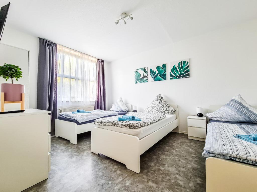 Ένα ή περισσότερα κρεβάτια σε δωμάτιο στο flat4short Dormagen