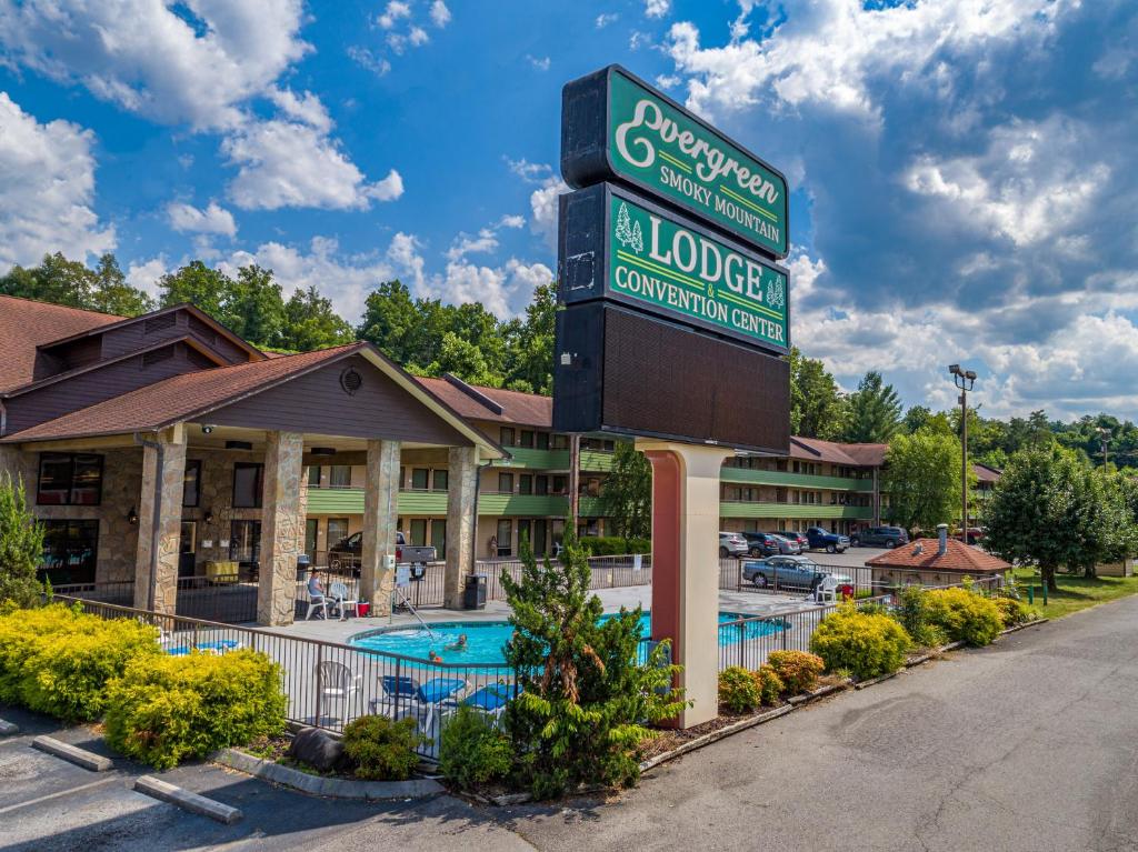 a hotel with a sign in front of a pool at Days Inn By Wyndham Pigeon Forge South in Pigeon Forge