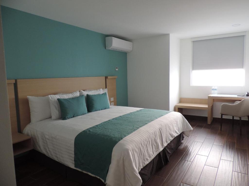 Postel nebo postele na pokoji v ubytování Hotel Plaza Sol Veracruz