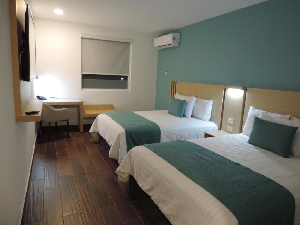 Postel nebo postele na pokoji v ubytování Hotel Plaza Sol Veracruz