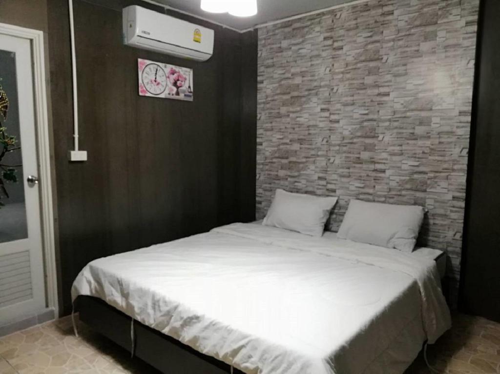Postel nebo postele na pokoji v ubytování E2S Place
