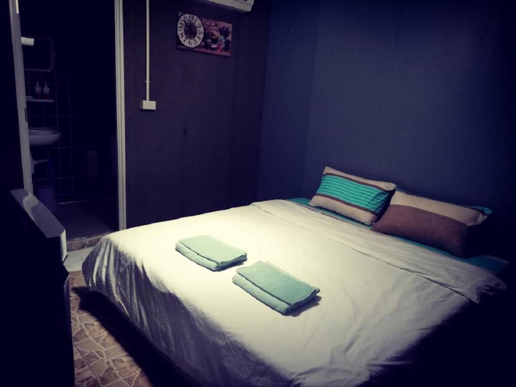 Postel nebo postele na pokoji v ubytování E2S Place