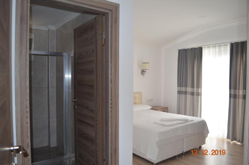 Postel nebo postele na pokoji v ubytování Hotel Uygar