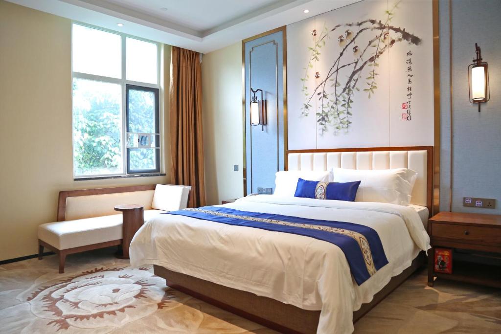 Postel nebo postele na pokoji v ubytování Guangdong Yingbin Hotel-Free Canton Fair Shuttle Bus