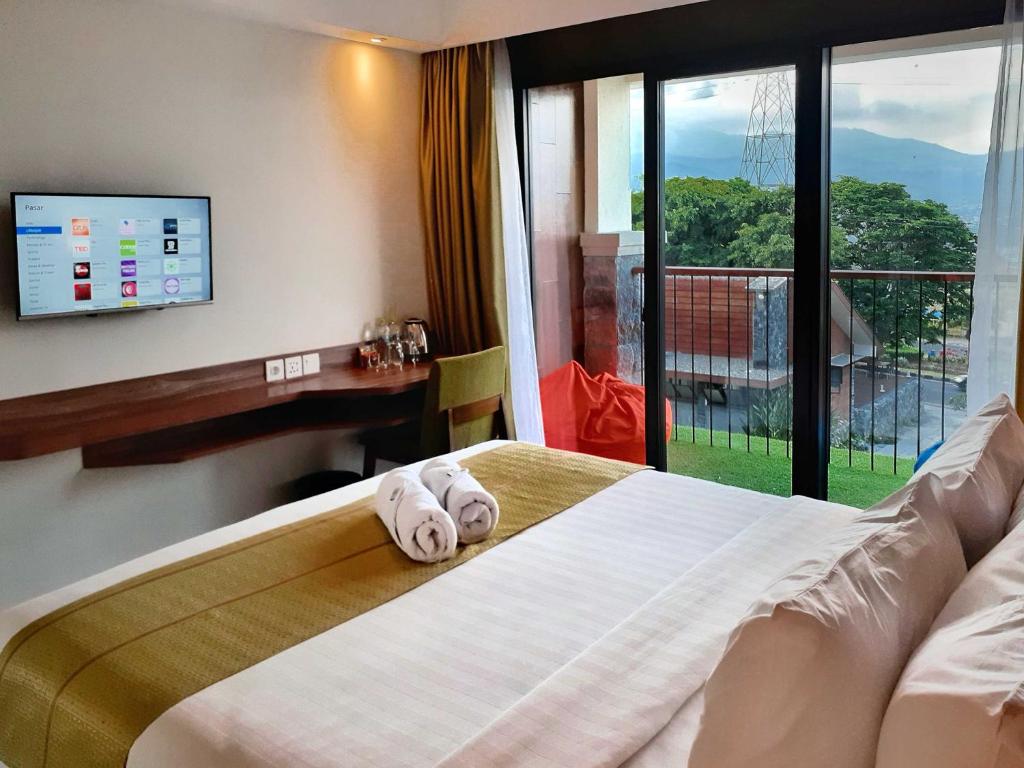 Postel nebo postele na pokoji v ubytování The Batu Hotel & Villas