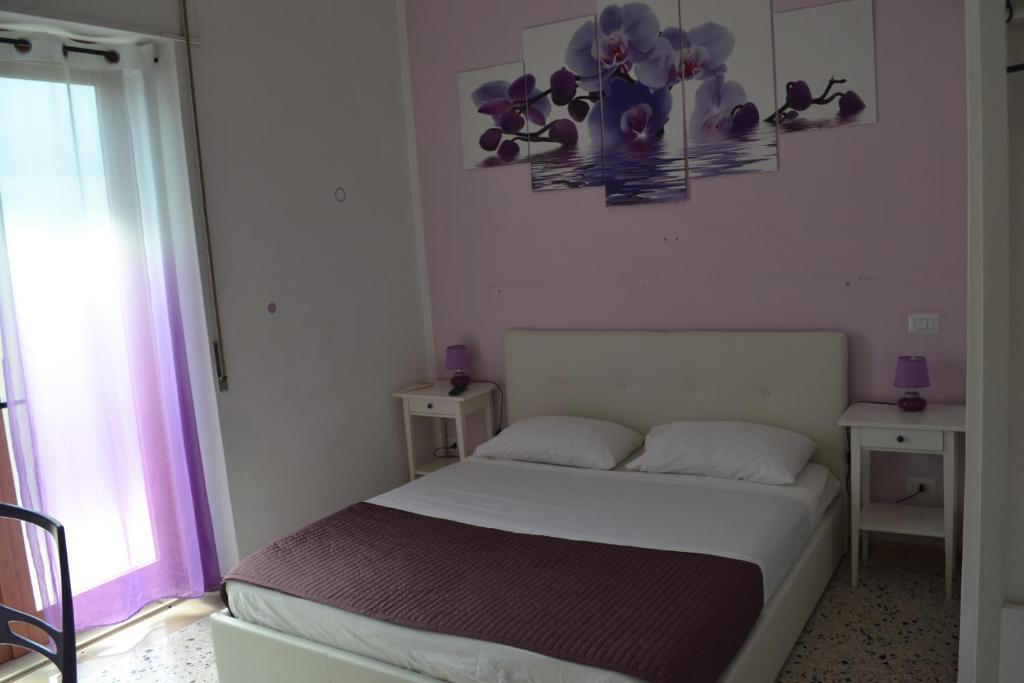 Postel nebo postele na pokoji v ubytování Sorrento Experience