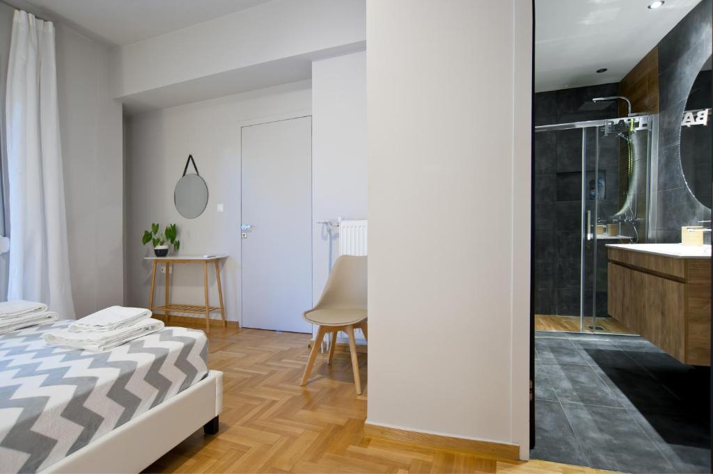 Posteľ alebo postele v izbe v ubytovaní Acropolis View Penthouse N