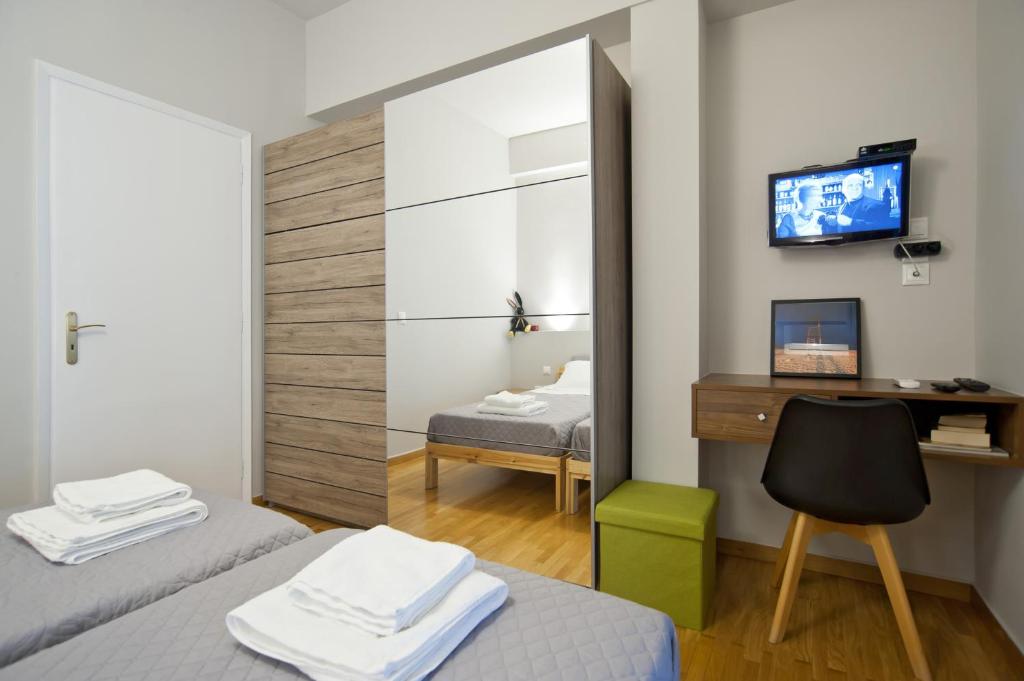 Posteľ alebo postele v izbe v ubytovaní Acropolis View Penthouse N