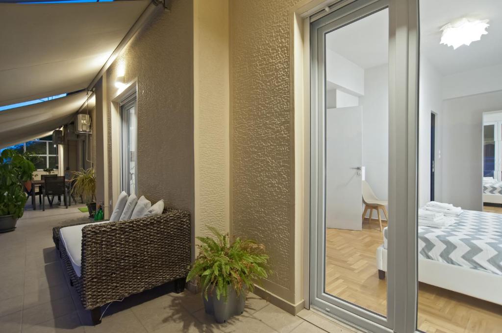 Posteľ alebo postele v izbe v ubytovaní Acropolis View Penthouse N