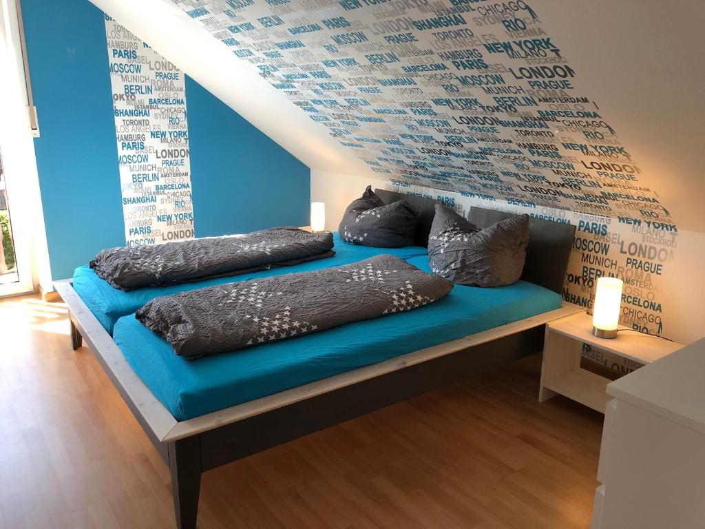 a room with a blue couch with pillows on it at Ferienhaus Casa Moderna in Wiesbaum