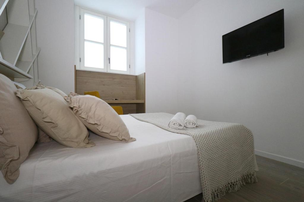 Postel nebo postele na pokoji v ubytování Affittacamere I Due Leoni