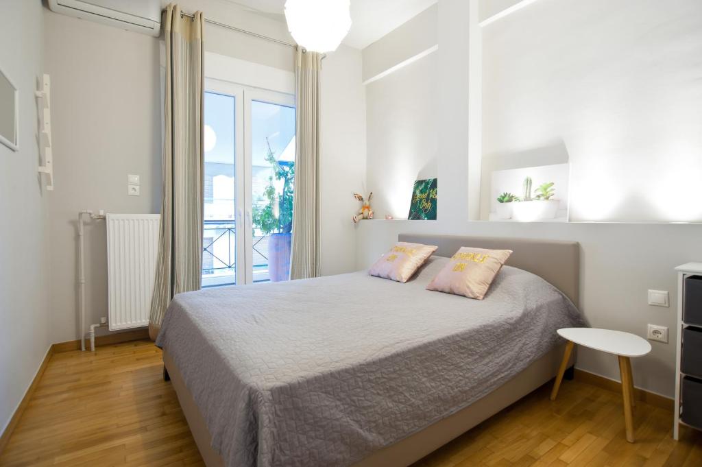 Posteľ alebo postele v izbe v ubytovaní Acropolis View Penthouse N