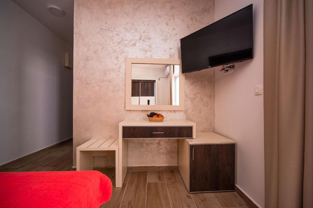 TV a/nebo společenská místnost v ubytování David Lux beach rooms