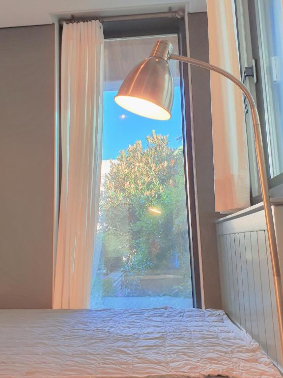 Postel nebo postele na pokoji v ubytování Picasso Guesthouse