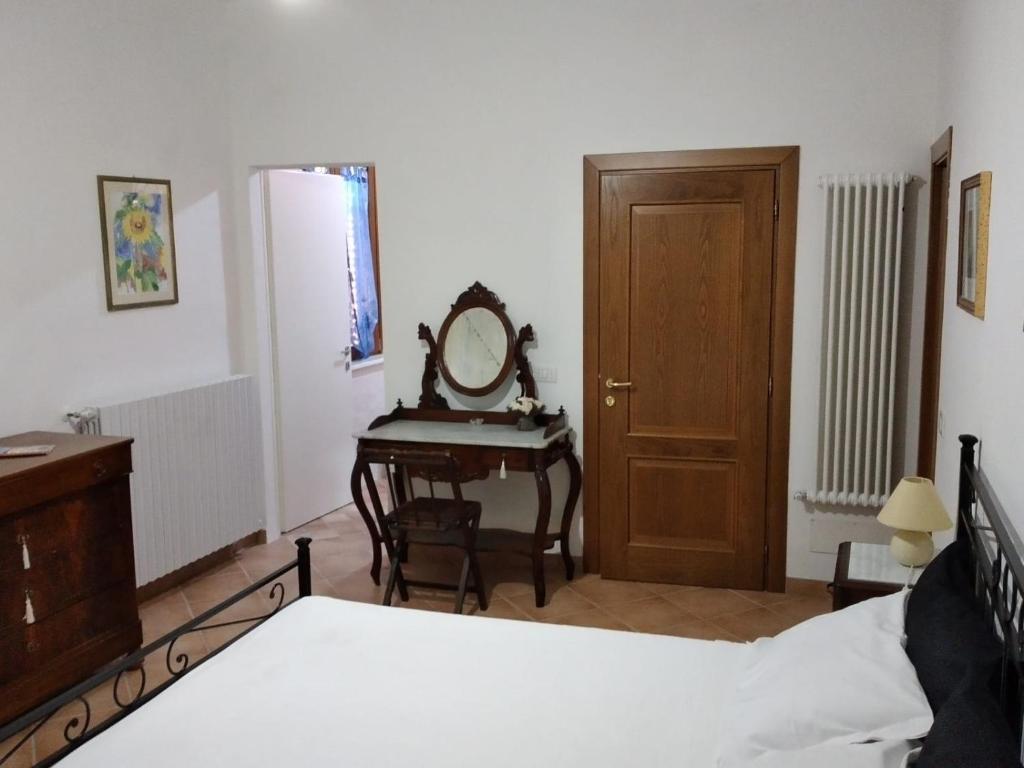 Postel nebo postele na pokoji v ubytování B&B L'Oliveto