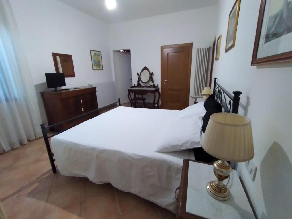 Postel nebo postele na pokoji v ubytování B&B L'Oliveto